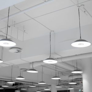 Shopping center led lighting. Ceiling lights in the mall. Ventilation and water pipes. Fire alarm system